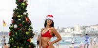 Австралийцы в шапках Санта-Клауса устроили жаркое Рождество на пляже: фото